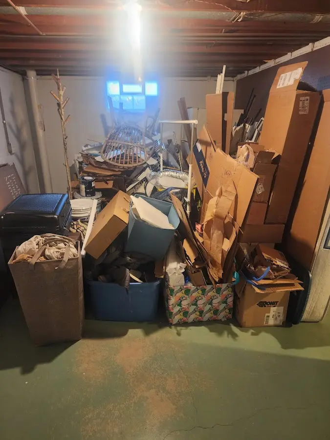 Roll-off dumpster container at job site for 15 Yard Dumpster Rental in Rogers